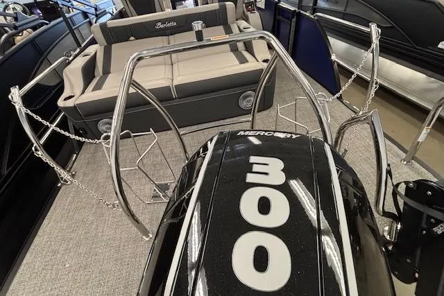 Slide: The Image of 2026 Barletta Corsa 23UC boat with Mercury 300 engine, featuring sleek seating and stainless steel railings. - 4