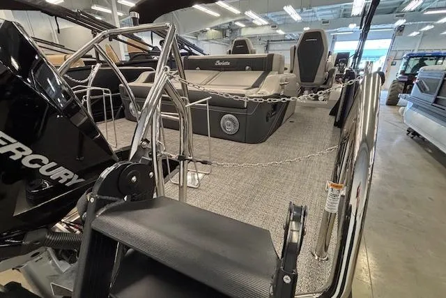 Slide: The Image of 2026 Barletta Corsa 23UC pontoon boat interior with seating and Mercury engine. - 5