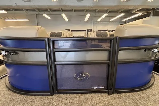 Slide: The Image of 2026 Barletta Corsa 23UC pontoon boat with sleek blue and gray design in showroom. - 8