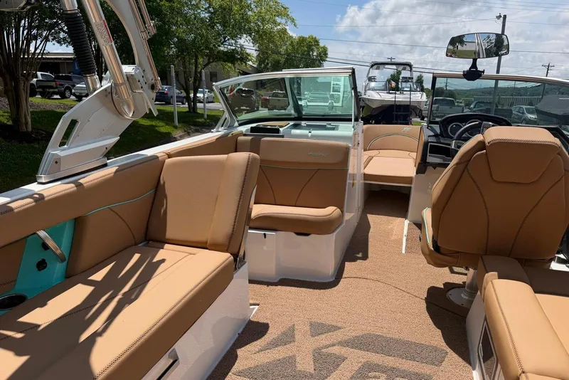 Slide: The Image of Interior of 2020 MasterCraft XT25 boat with tan seating and modern design. - 12