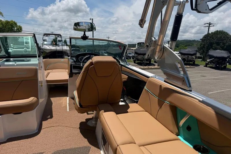 Slide: The Image of 2020 MasterCraft XT25 boat interior with tan seating and modern design elements. - 15