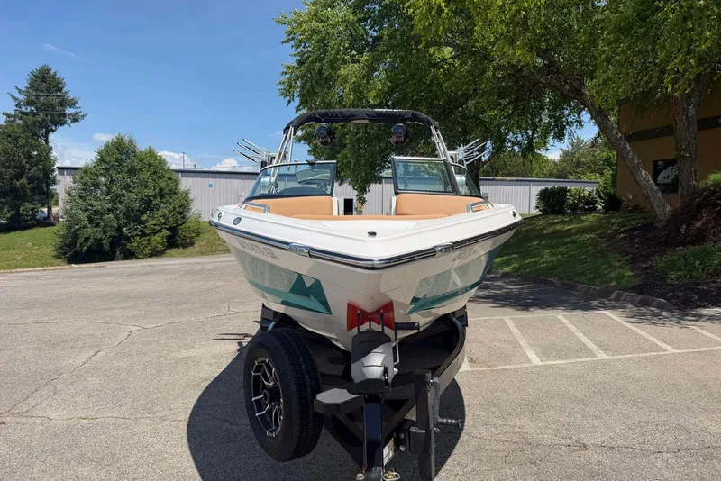 Slide: The Image of 2020 MasterCraft XT25 boat on trailer in sunny outdoor setting. - 3