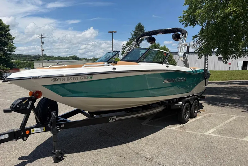 Slide: The Image of 2020 MasterCraft XT25 boat on trailer in parking lot, sunny day. - 5