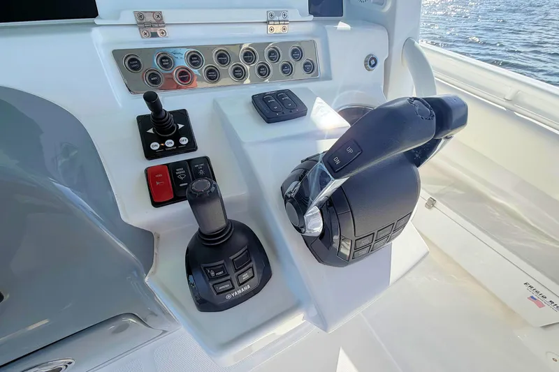 Slide: The Image of Control panel of a 2020 HCB 42 Siesta boat with joystick and throttle. - 10