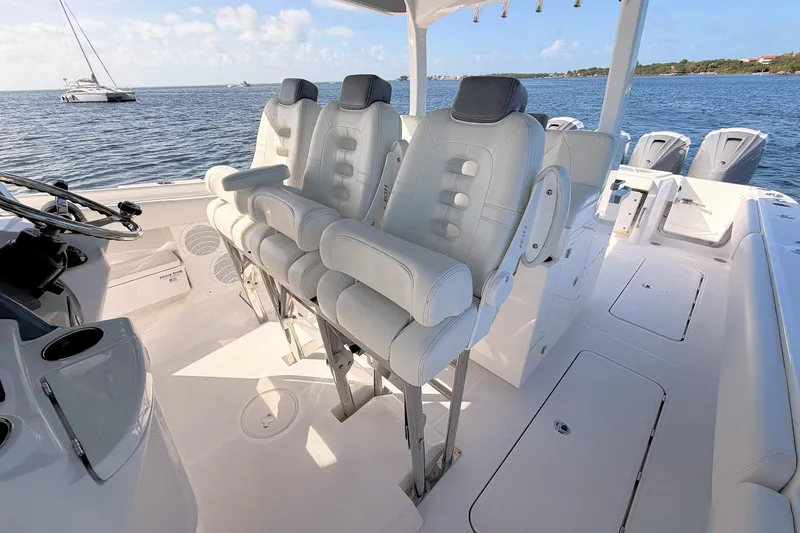 Slide: The Image of 2020 HCB 42 Siesta boat interior with luxurious seating and ocean view. - 12