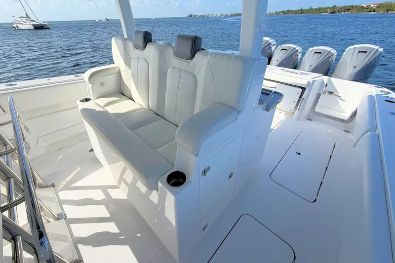 Slide: The Image of 2020 HCB 42 Siesta boat interior with seating and multiple outboard engines. - 13