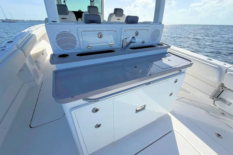 Slide: The Image of 2020 HCB 42 Siesta boat with sleek outdoor kitchen and ocean view. - 17