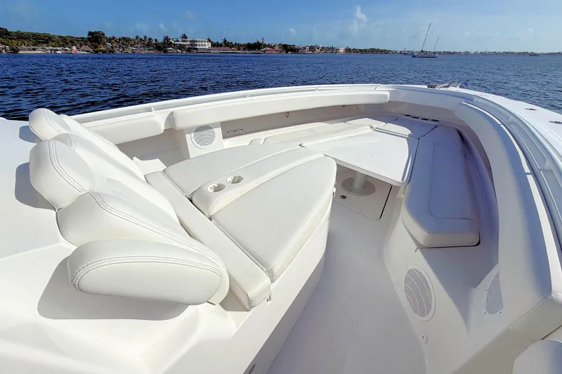Slide: The Image of Luxurious seating on 2020 HCB 42 Siesta boat, with ocean view in background. - 19