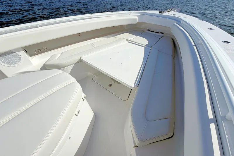 Slide: The Image of Luxurious seating area on 2020 HCB 42 Siesta boat, featuring white upholstery and sleek design. - 20
