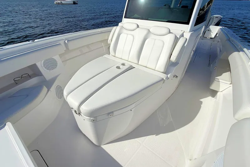 Slide: The Image of Luxurious 2020 HCB 42 Siesta boat interior with white seating and ocean view. - 22