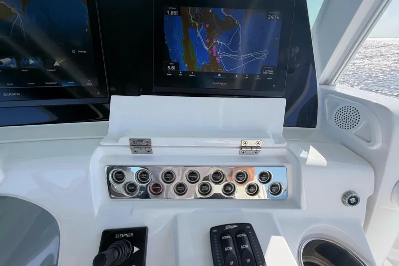 Slide: The Image of Helm of 2020 HCB 42 Siesta with Garmin navigation displays and control panel. - 8