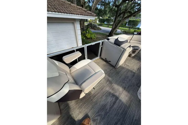 Slide: The Image of 2023 Tahoe Pontoon LTZ 2385 QUAD LOUNGE interior with plush seating and modern design. - 2