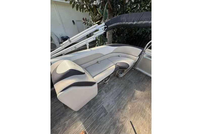 Slide: The Image of 2023 Tahoe Pontoon LTZ 2385 QUAD LOUNGE interior with plush seating and modern design. - 3