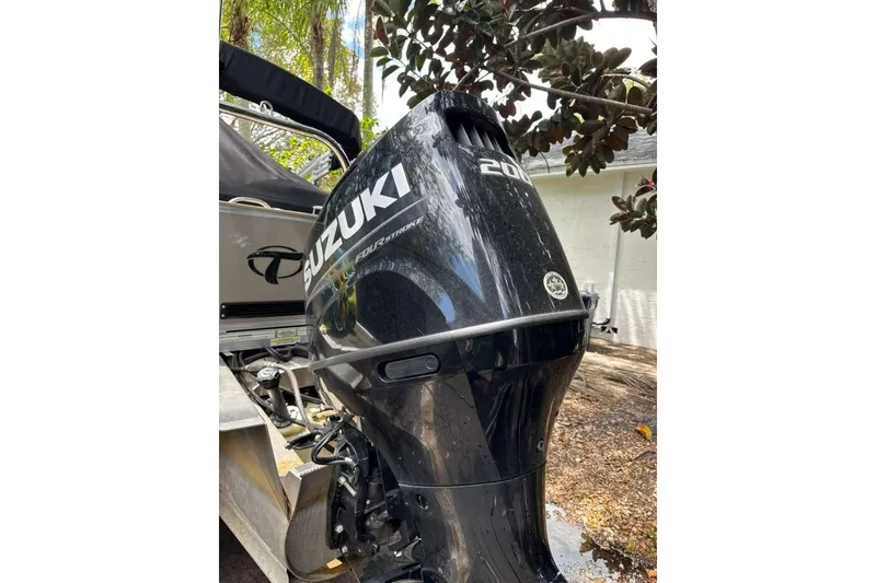 Slide: The Image of Suzuki outboard motor on 2023 Tahoe Pontoon LTZ 2385 QUAD LOUNGE boat. - 5