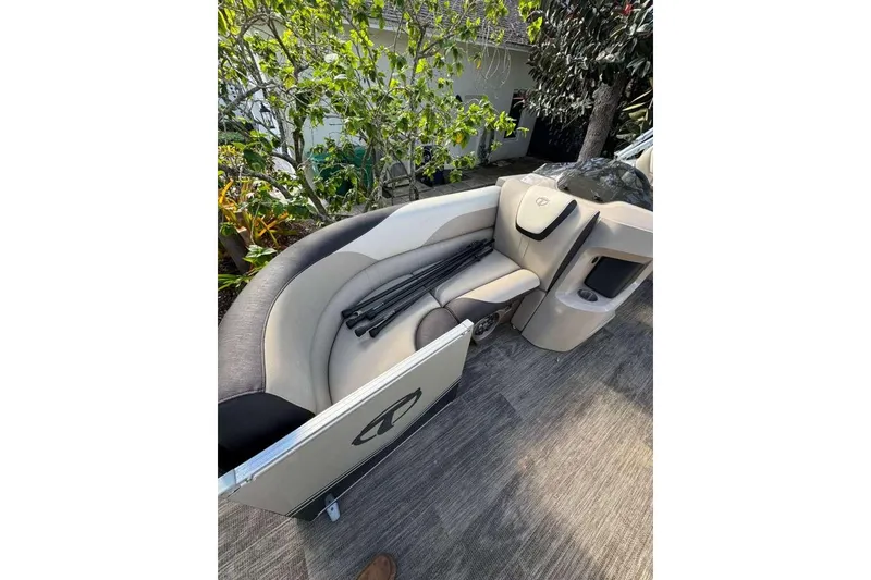Slide: The Image of 2023 Tahoe Pontoon LTZ 2385 QUAD LOUNGE interior with plush seating and sleek design. - 7