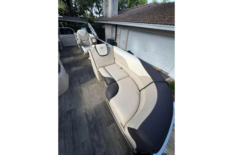 Slide: The Image of 2023 Tahoe Pontoon LTZ 2385 QUAD LOUNGE with luxurious seating and sleek design. - 8