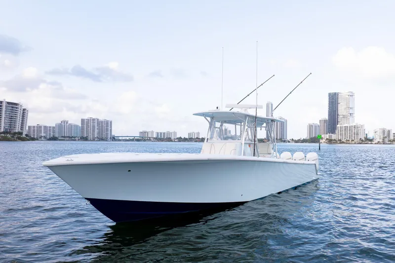The Image of 2023 SeaVee 390Z boat on water with city skyline background. - 0