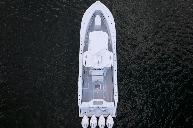 Slide: The Image of Overhead view of 2023 SeaVee 390Z boat on dark water. - 12