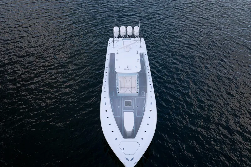 Slide: The Image of 2023 SeaVee 390Z boat on calm water, aerial view showcasing sleek design. - 13