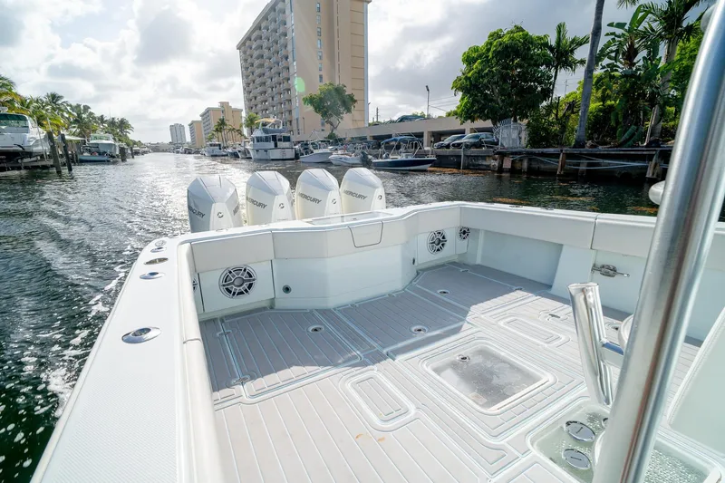 Slide: The Image of 2023 SeaVee 390Z boat with Mercury engines cruising on a sunny waterway. - 14