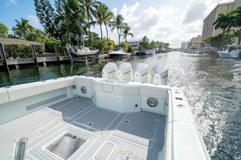 Slide: The Image of 2023 SeaVee 390Z boat with Mercury engines cruising on a sunny canal. - 16