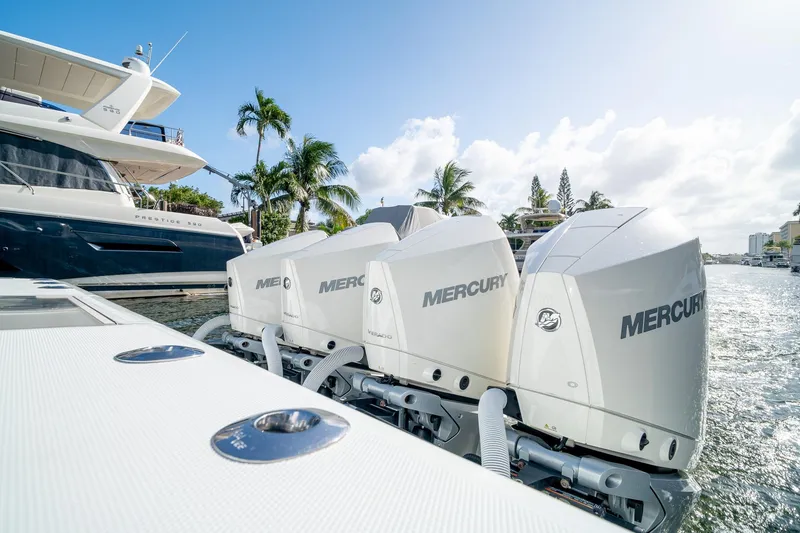 Slide: The Image of 2023 SeaVee 390Z boat with Mercury outboard engines docked near luxury yacht. - 22