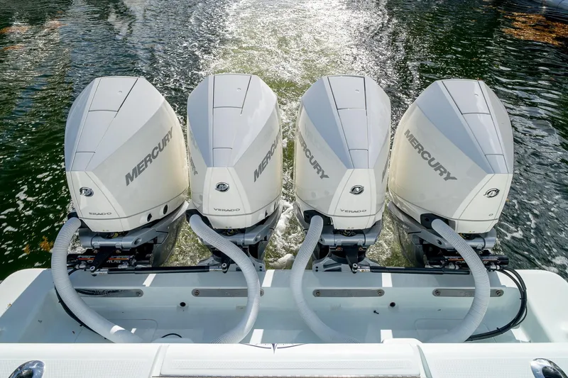 Slide: The Image of 2023 SeaVee 390Z boat with four Mercury Verado outboard engines on water. - 23