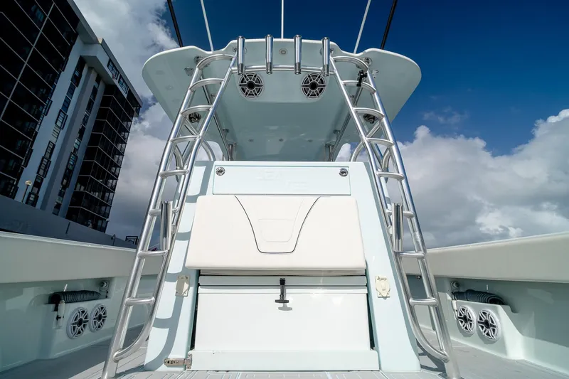 Slide: The Image of 2023 SeaVee 390Z boat with tower ladder and speakers, under a clear blue sky. - 29