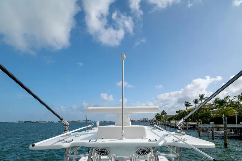 Slide: The Image of 2023 SeaVee 390Z boat on water with clear blue sky and palm trees. - 42