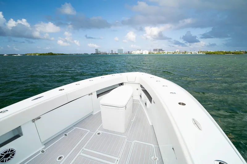 Slide: The Image of 2023 SeaVee 390Z boat on water with city skyline in background. - 48