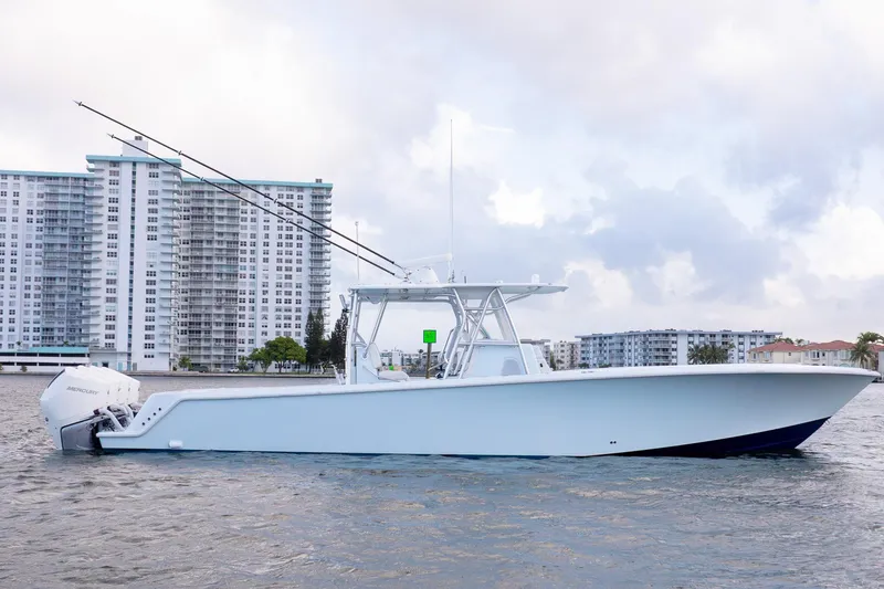 Slide: The Image of 2023 SeaVee 390Z boat on water with cityscape background. - 5