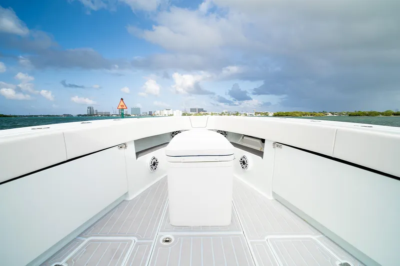 Slide: The Image of 2023 SeaVee 390Z boat deck with ocean view and cloudy sky. - 50