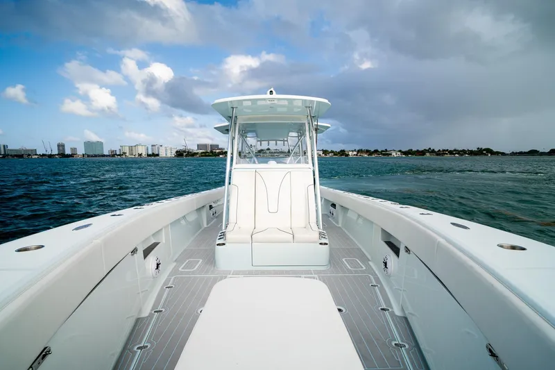 Slide: The Image of 2023 SeaVee 390Z boat on water, featuring spacious deck and modern design. - 52