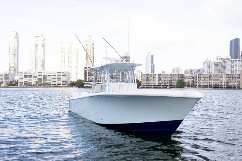 Slide: The Image of 2023 SeaVee 390Z boat on water with city skyline background. - 6