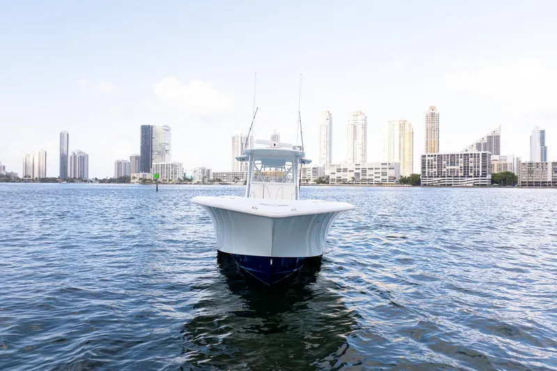 Slide: The Image of 2023 SeaVee 390Z boat on water with city skyline in background. - 7