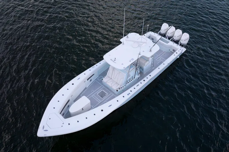 Slide: The Image of 2023 SeaVee 390Z boat on water, aerial view, showcasing sleek design and multiple engines. - 8