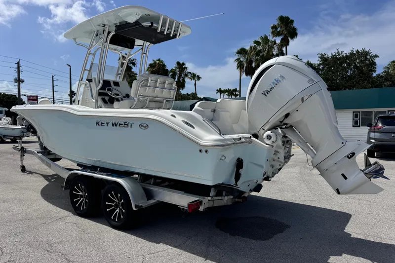 Slide: The Image of 2026 Key West 239 FS boat on trailer with Yamaha outboard motor. - 2