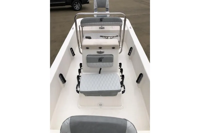 Slide: The Image of 2025 Carolina Skiff E18 JVX CC boat interior with seating and console. - 1