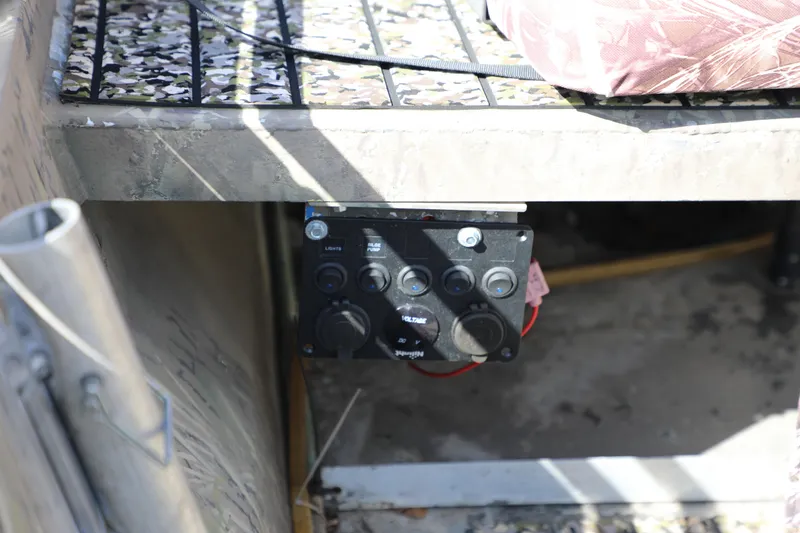 Slide: The Image of Control panel on a 2017 Gator Tail 16 boat, featuring switches and wiring. - 5