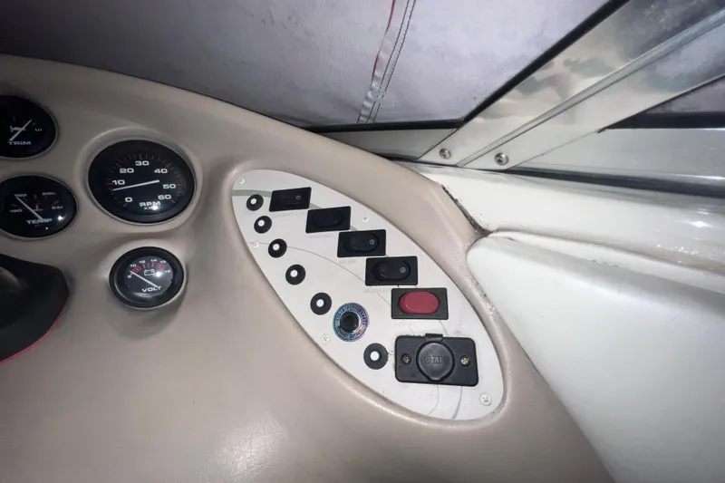 Slide: The Image of Dashboard controls of a 1996 Rinker 232 Captiva Cuddy boat. - 10