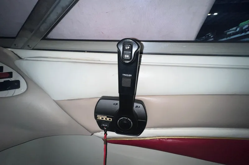 Slide: The Image of Throttle control of a 1996 Rinker 232 Captiva Cuddy boat interior. - 11