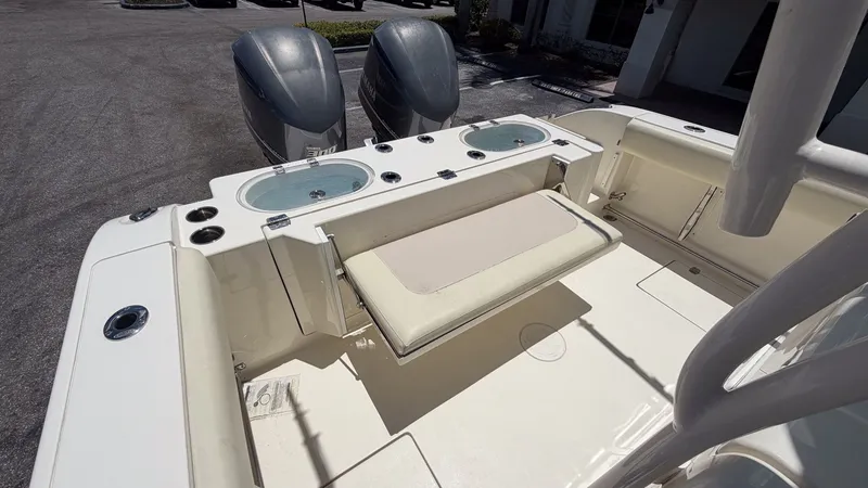 Slide: The Image of 2015 Cobia 296 Center Console with dual engines and seating area. - 12