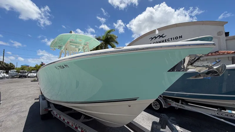 Slide: The Image of 2015 Cobia 296 Center Console boat on trailer at Boat Connection. - 17