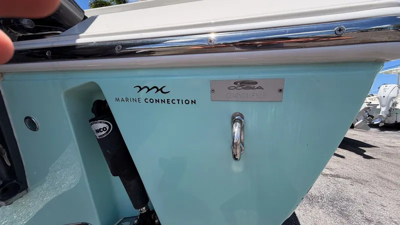 Slide: The Image of 2015 Cobia 296 Center Console boat, Marine Connection logo. - 19