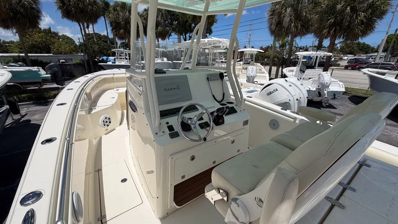 Slide: The Image of 2015 Cobia 296 Center Console boat with helm and Garmin system. - 8