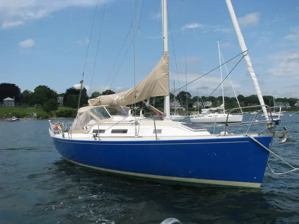 Slide: The Image of Blue 1998 J Boats J/32 sailboat on calm water. - 1