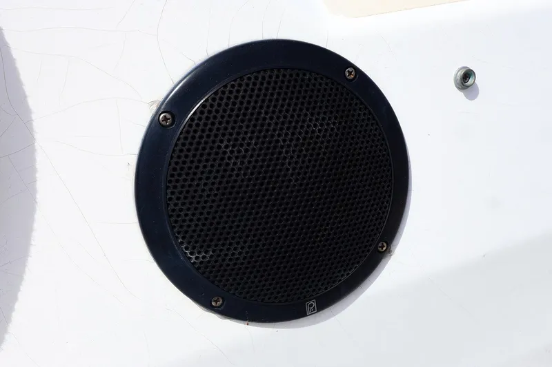 Slide: The Image of Black speaker on a 1998 J Boats J/32 sailboat's white surface. - 19