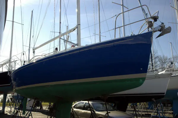 Slide: The Image of 1998 J Boats J/32 sailboat on a dry dock. - 2