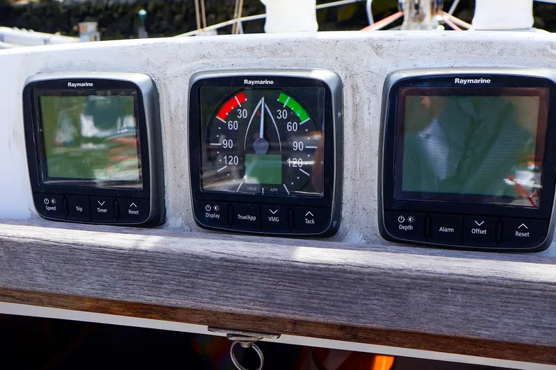 Slide: The Image of Raymarine instruments on a 1998 J Boats J/32 sailboat dashboard. - 21