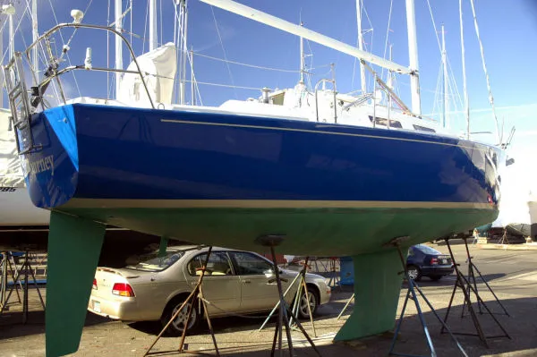 Slide: The Image of 1998 J Boats J/32 sailboat on stands in harbor. - 3